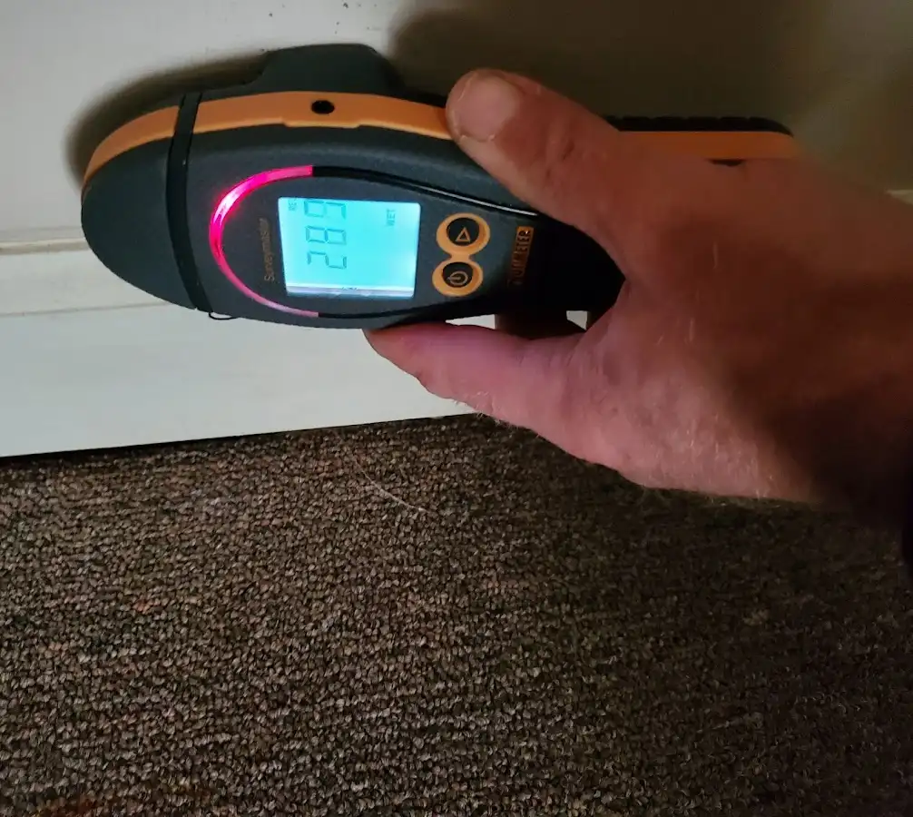 Moisture detection at baseboard during Storm Damage Restoration in River Forest